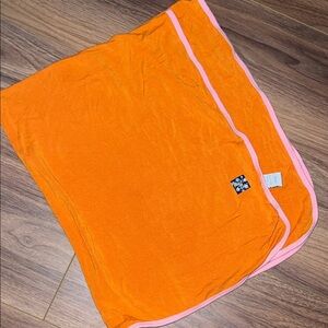 Orange kickee pants swaddle/blanket